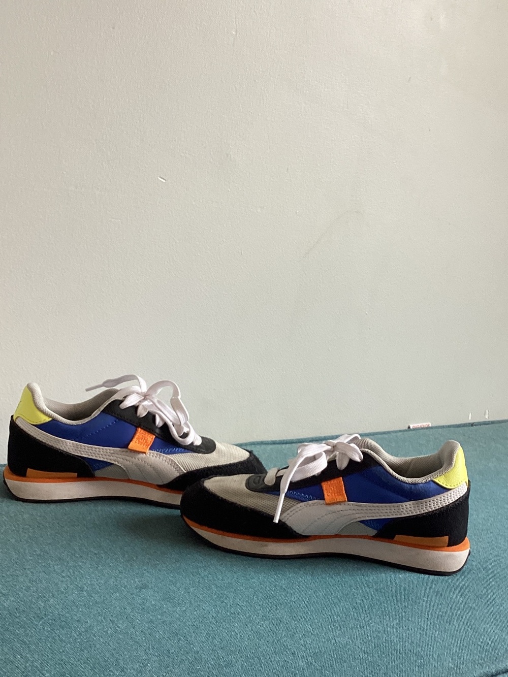Puma Kids White, Blue & Black Sneakers with Orange Accents